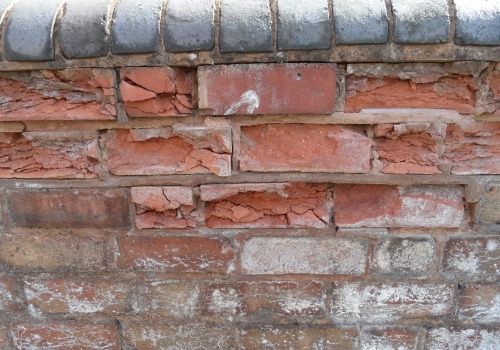 What are the common reasons that masonry structures fail?